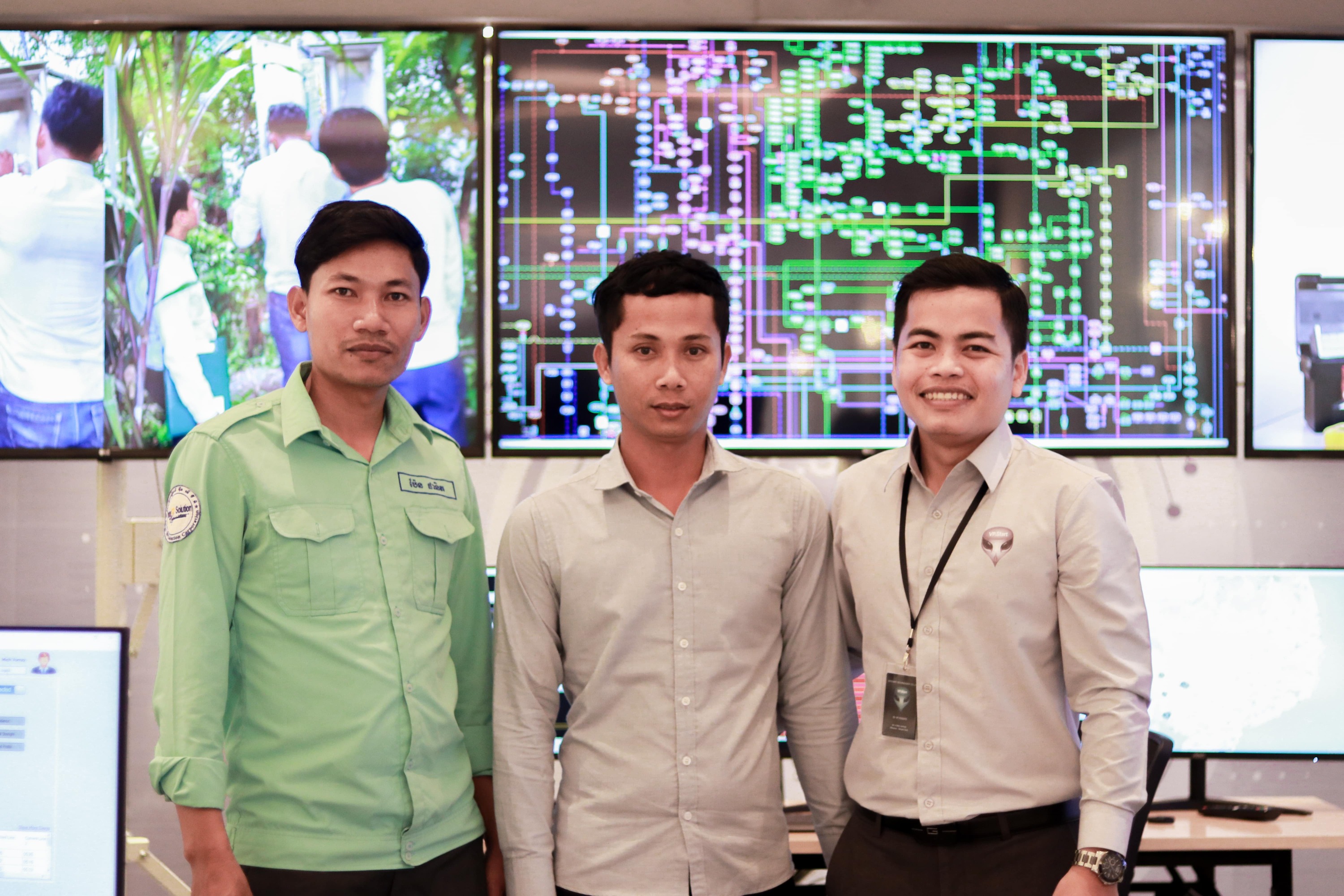 Vong Sarak with Two Event Participants infront of VP Start Smart Grid System